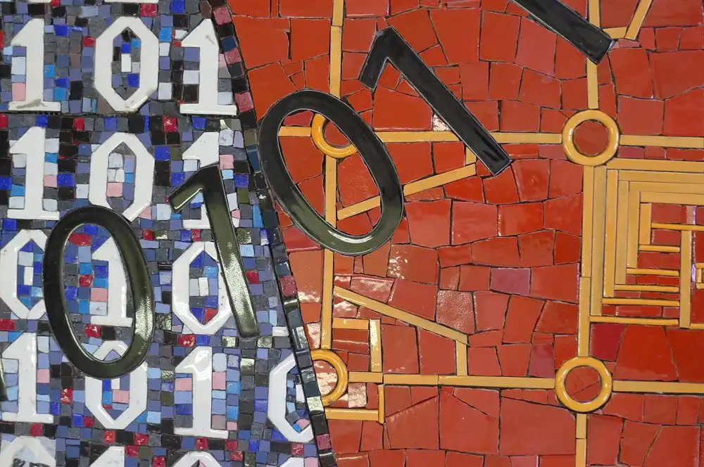 Mosaic artwork featuring black numbers and binary code on vibrant red and blue backgrounds.