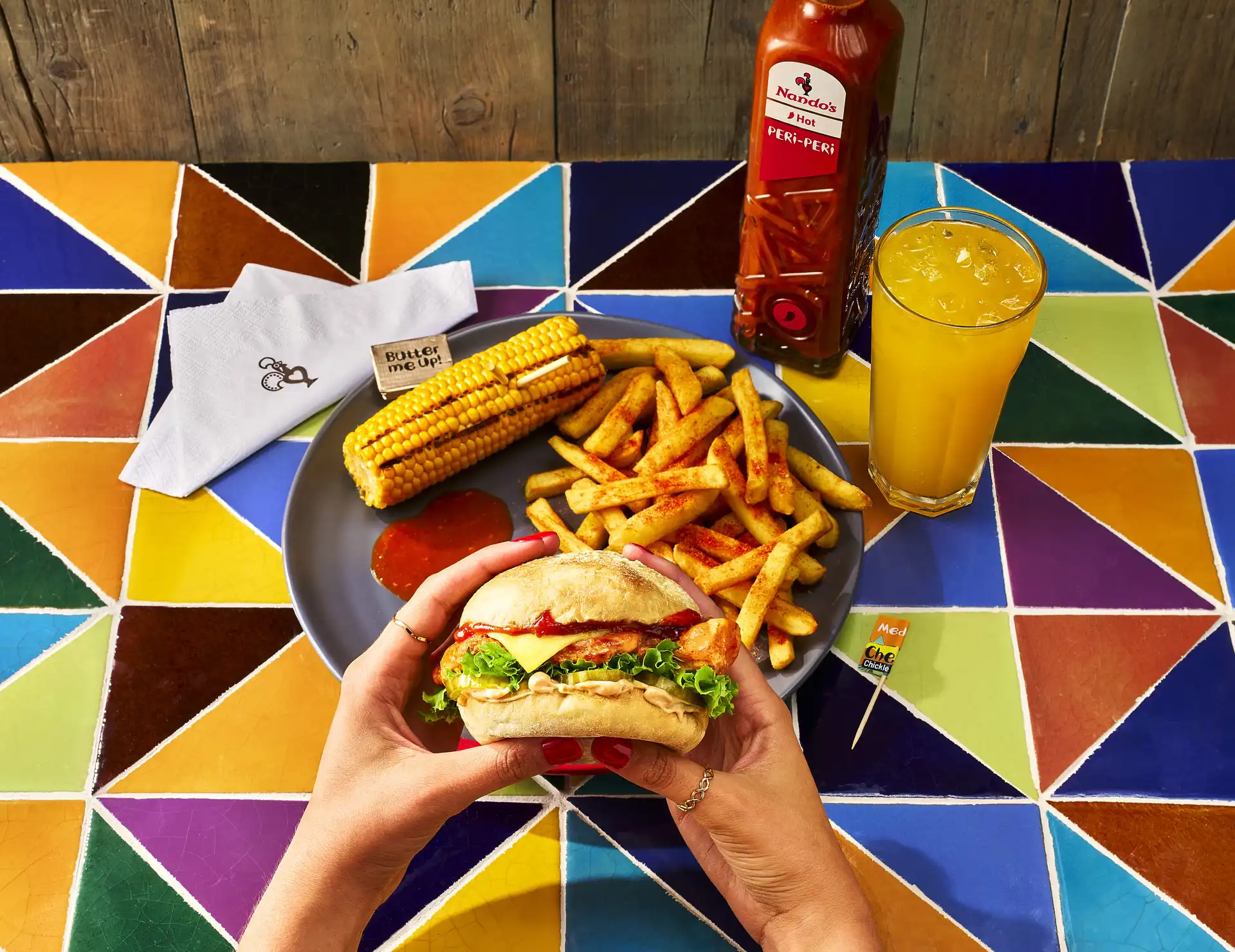 Nando's Cheesey Chickle Burger with PERi-Salted Chips, Corn on the Cob and Bottomless Fanta Zero Sugar