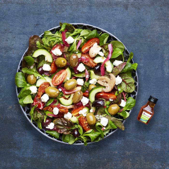 Nando's Mediterranean Salad on a blue background